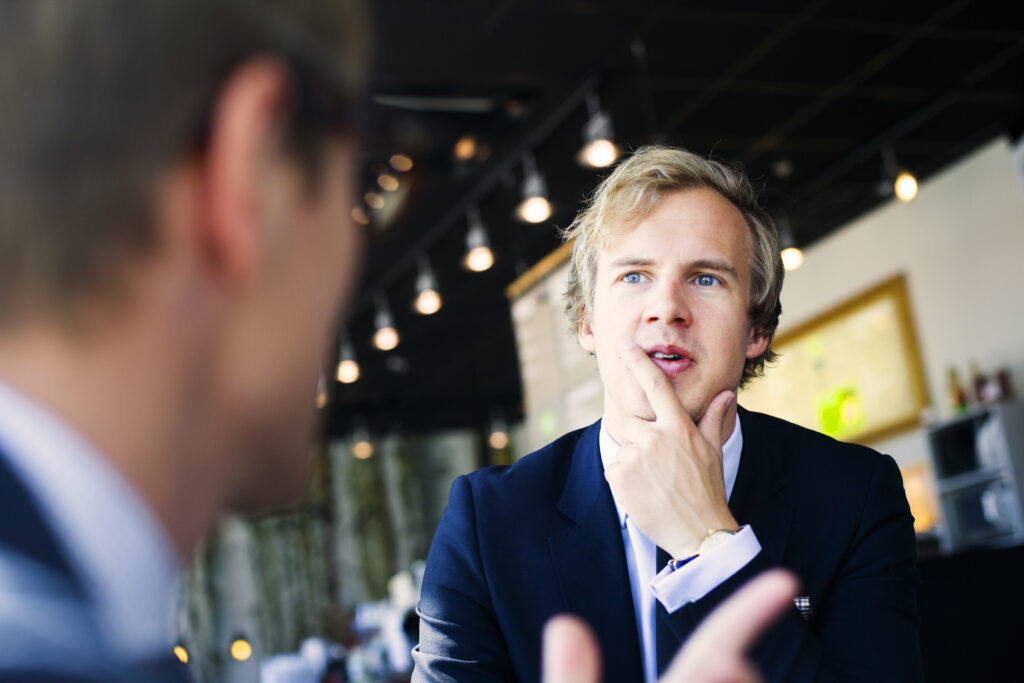 Sales representative talking about promotions with a client
