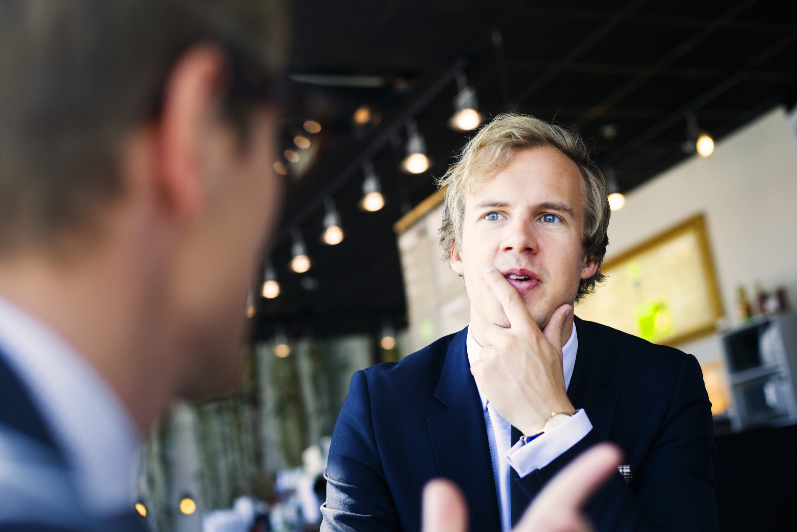 Sales representative talking about promotions with a client