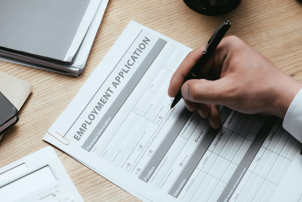 New graduate filling out a job application form